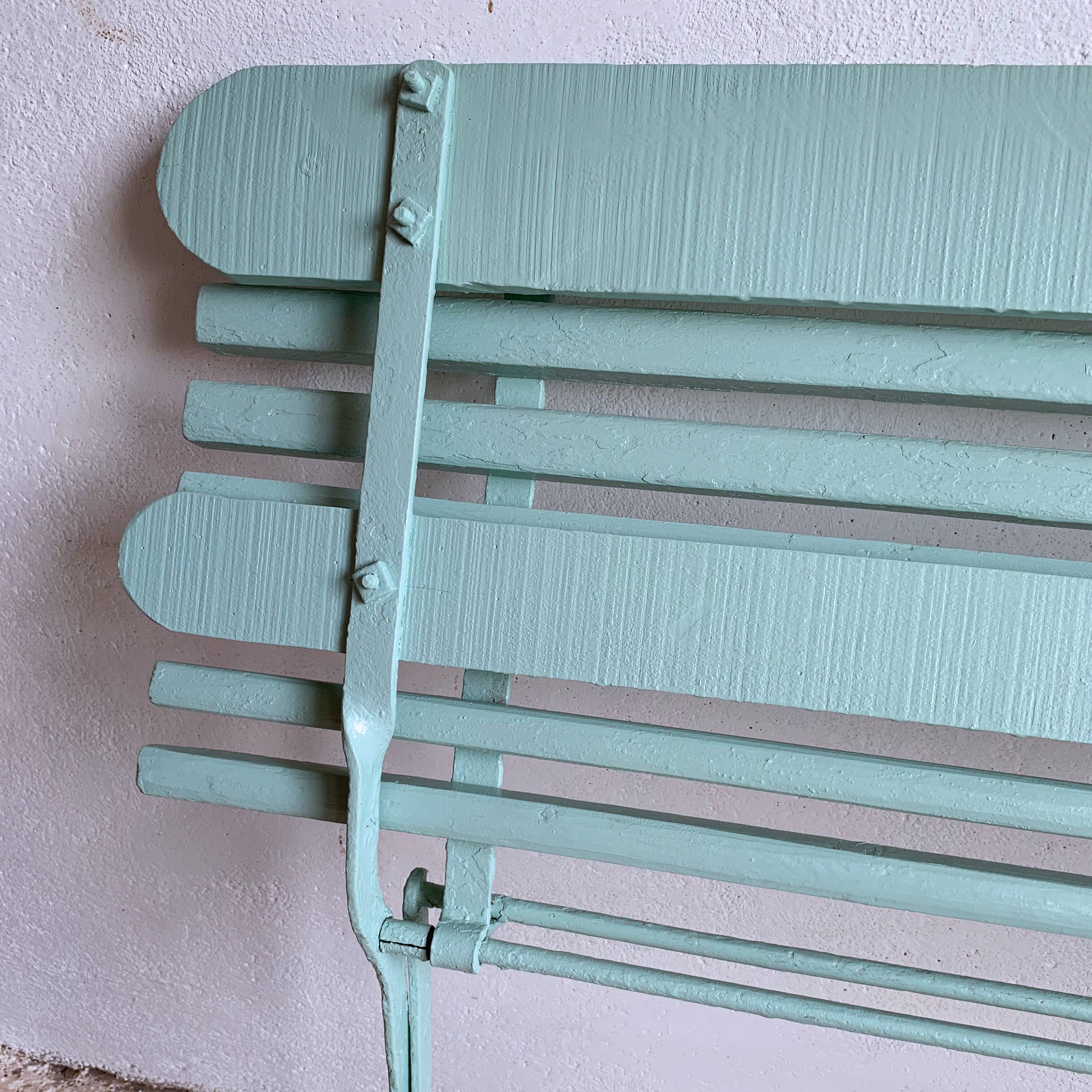 Former folding garden bench with wooden and metal slats