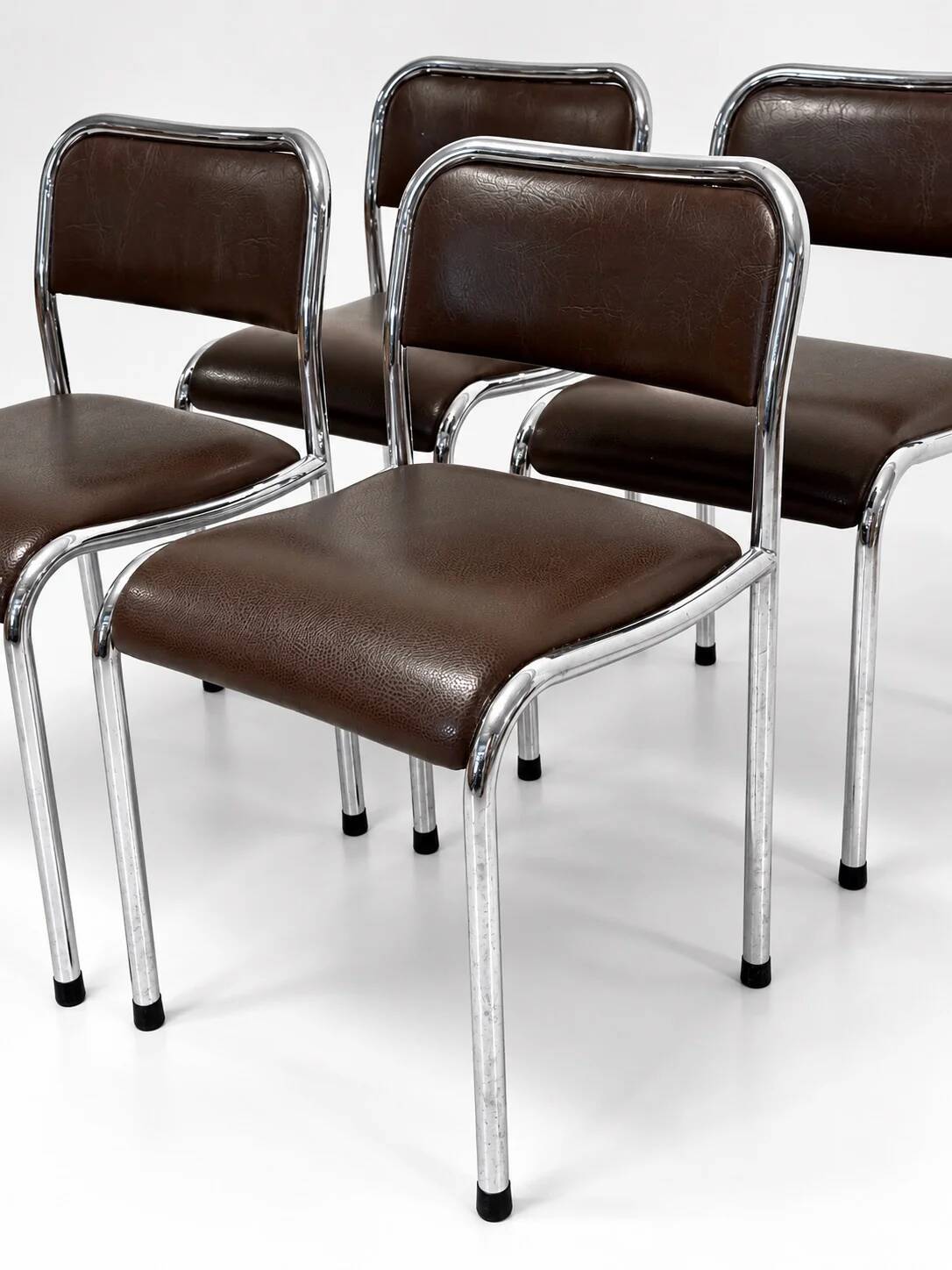 Set of 4 vintage dining chairs in chrome, brown faux leather, 1970s.