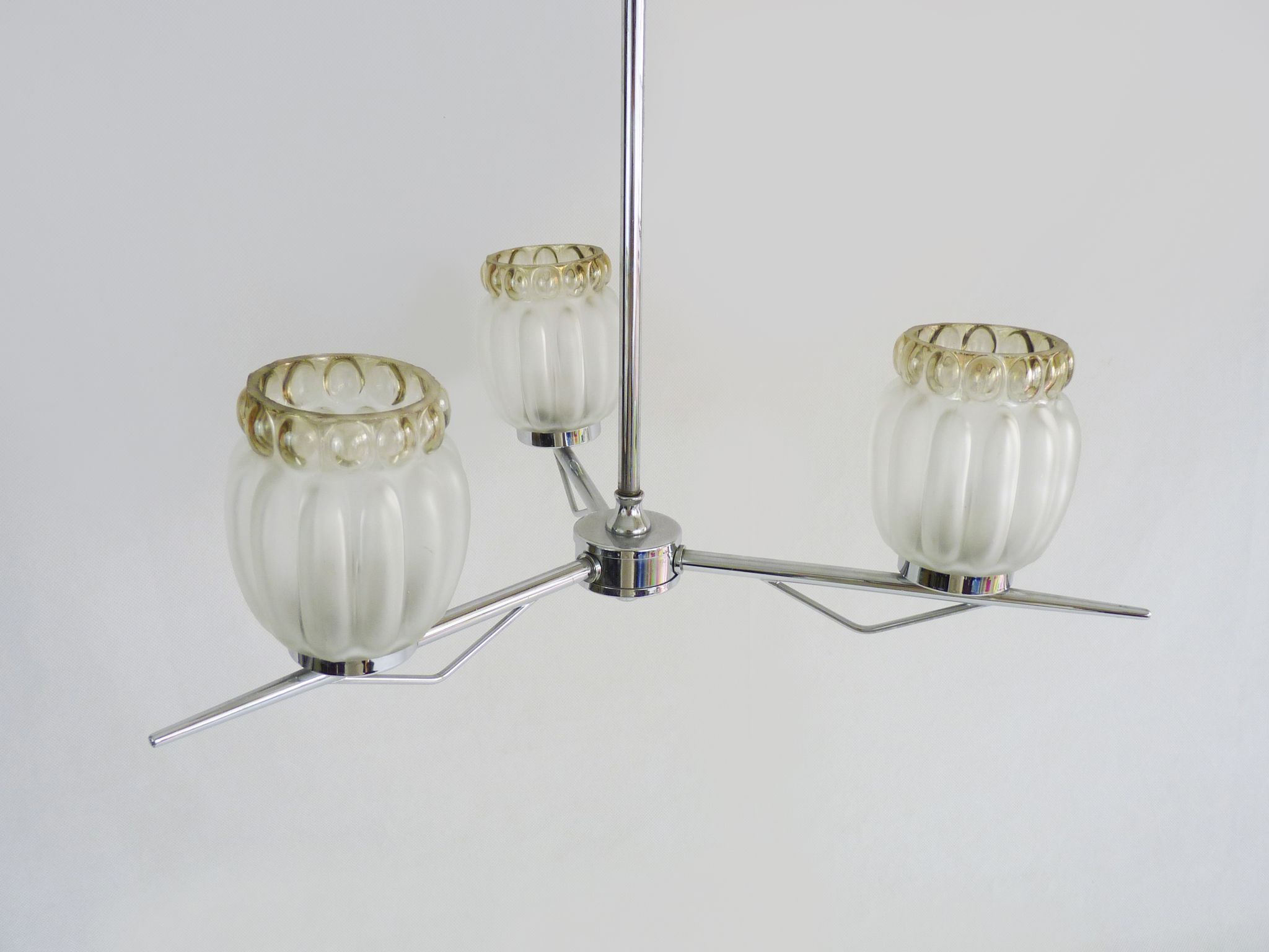 Vintage chandelier with 3 branches in chrome metal and glass globe. Year 70