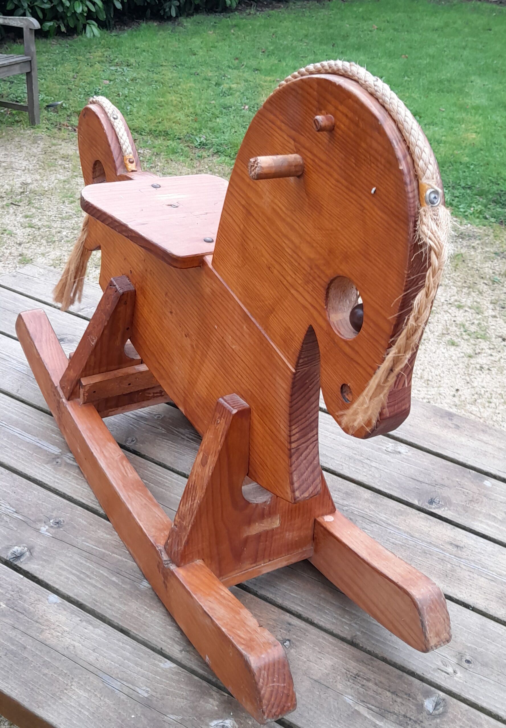 Rocking horse in raw and glazed wood