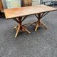 Vintage 1950s set: large table with tripod base and benches in woven chestnut