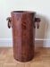 Art Deco umbrella stand in walnut with staves and ring handles, 1930.