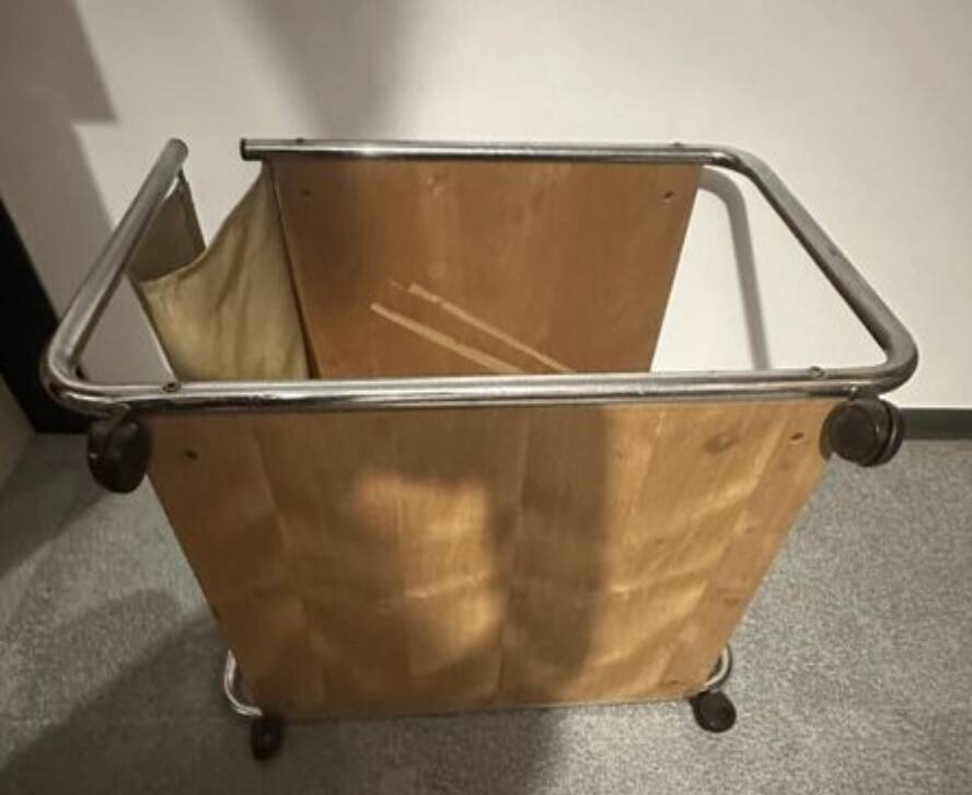 1970s/80s coffee table on casters with metal tubing, light-colored door