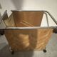 1970s/80s coffee table on casters with metal tubing, light-colored door