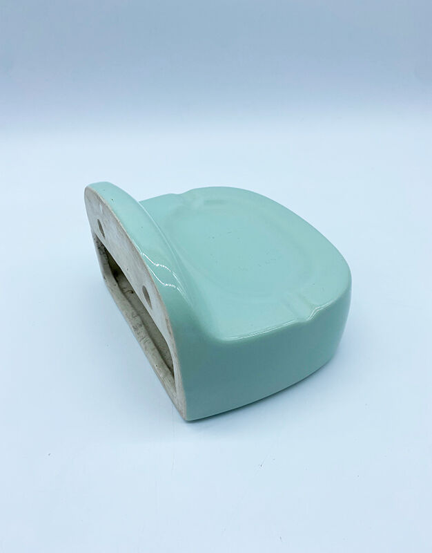 Wall-mounted ashtray and toilet paper dispenser