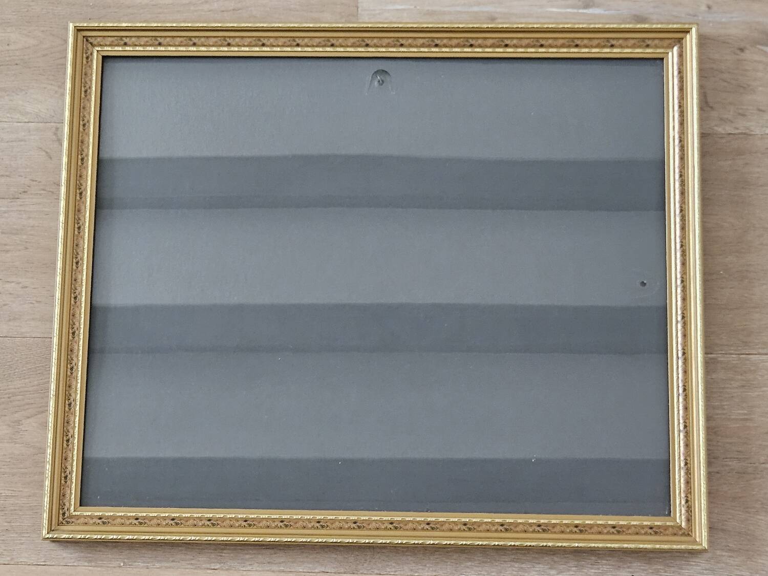 Golden frame with purple floral patterns