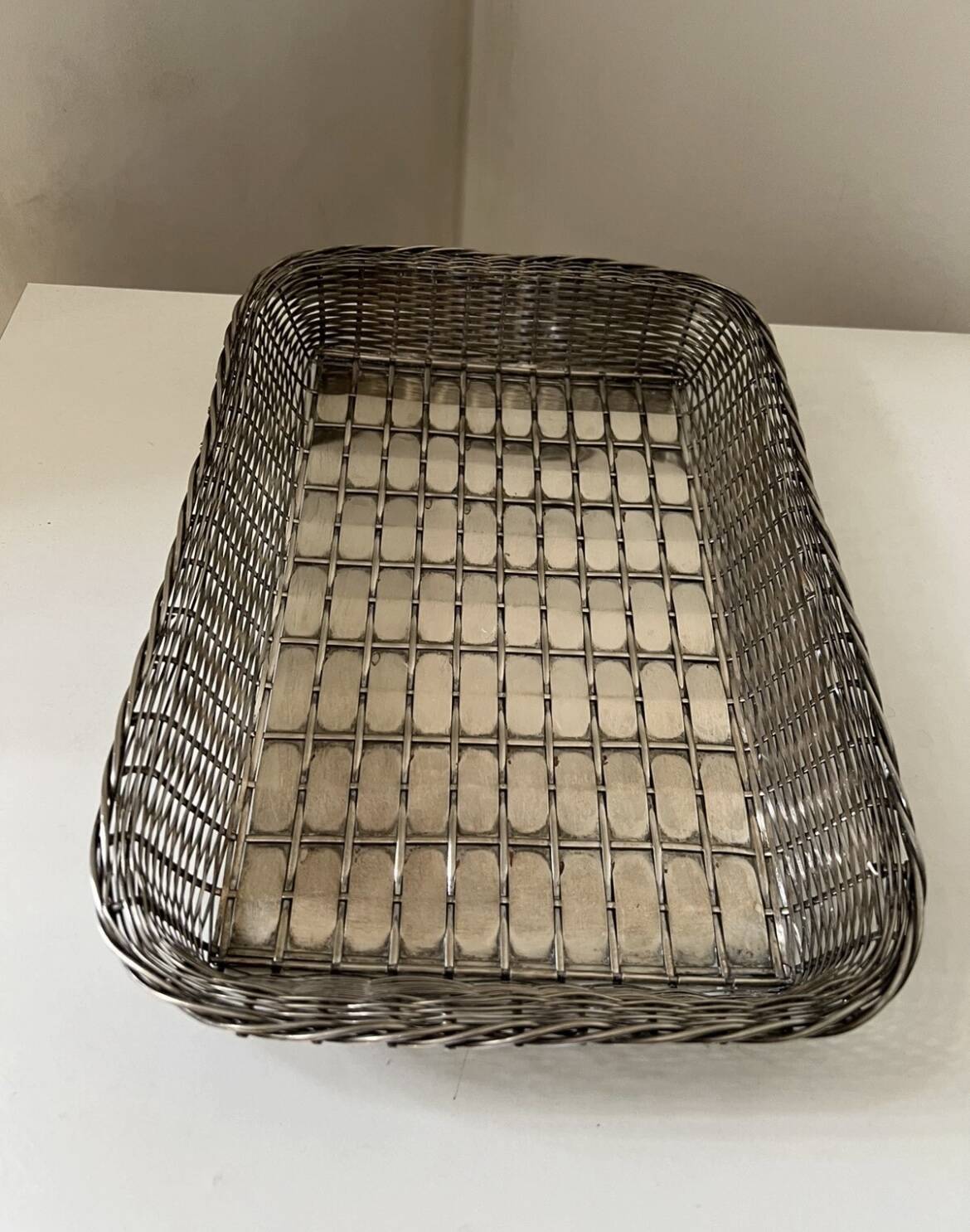 Woven silver metal bread basket
