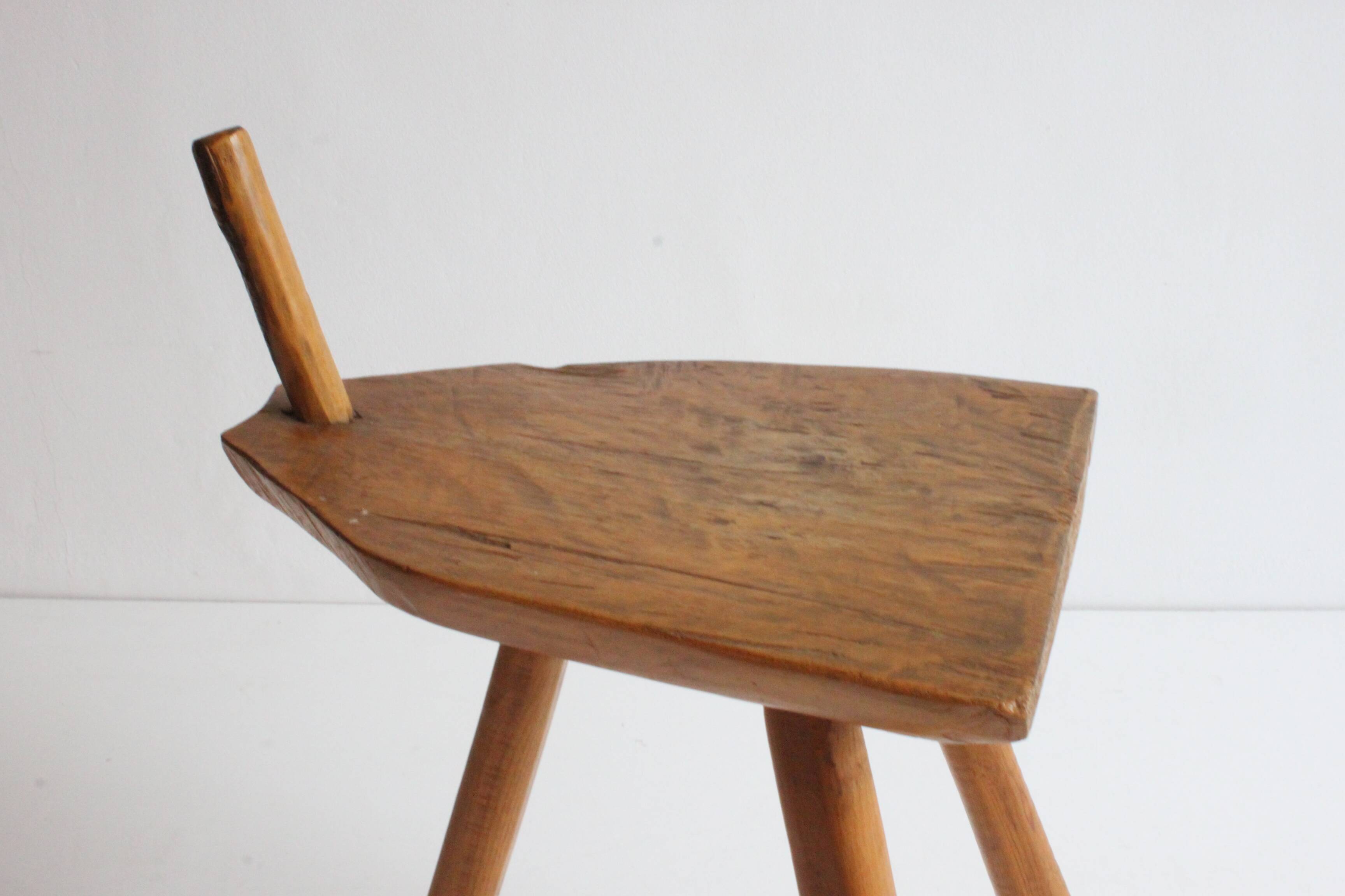 Brutalist tripod stool in carved wood, 1950s