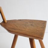 Brutalist tripod stool in carved wood, 1950s