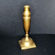 Antique baluster candlestick in bronze with hand-chiseled design.