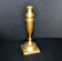 Antique baluster candlestick in bronze with hand-chiseled design.