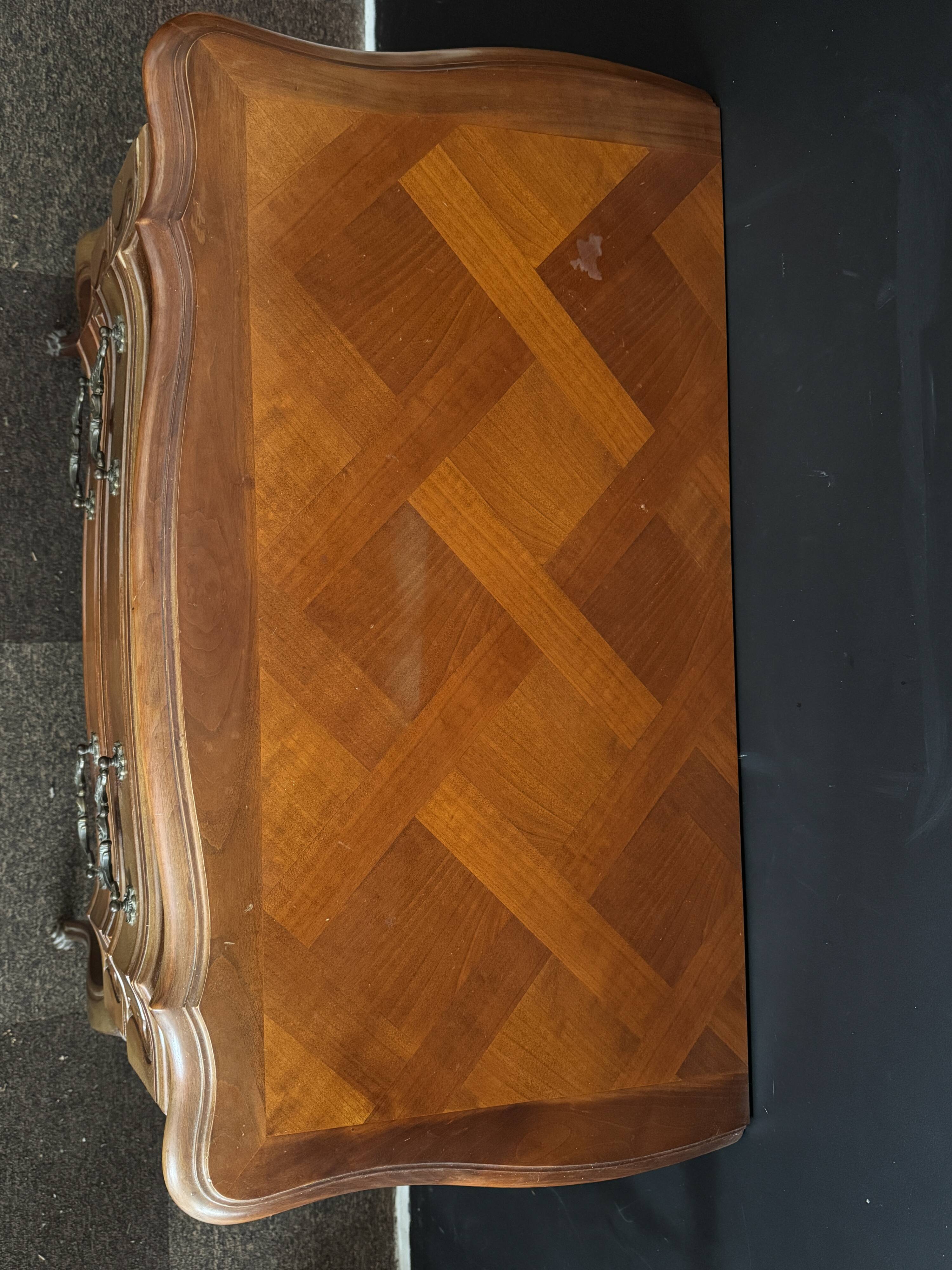Carved wooden chest of drawers