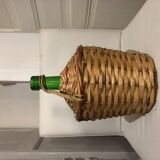 Demijohn in wicker basket