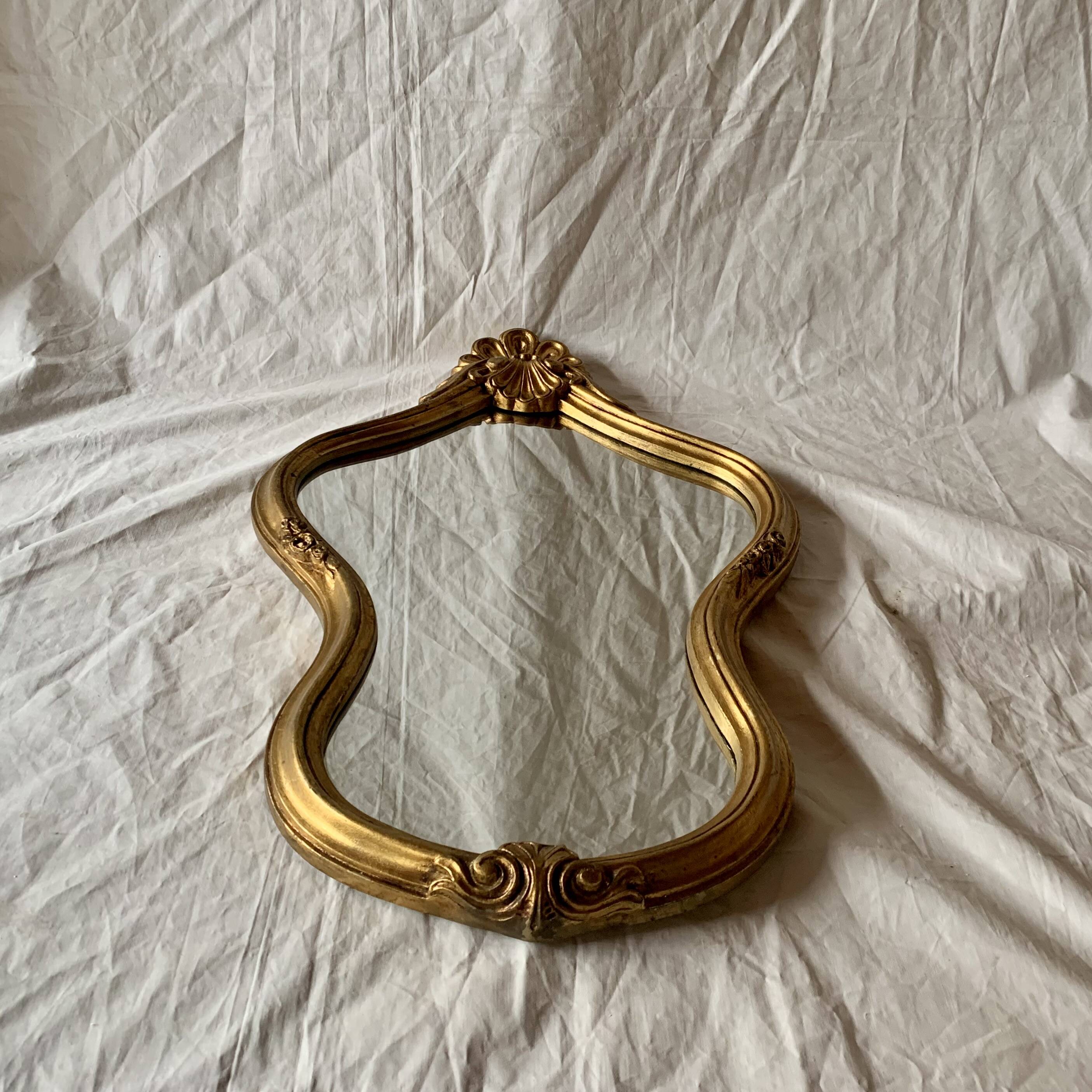 Large rococo mirror in gilded wood