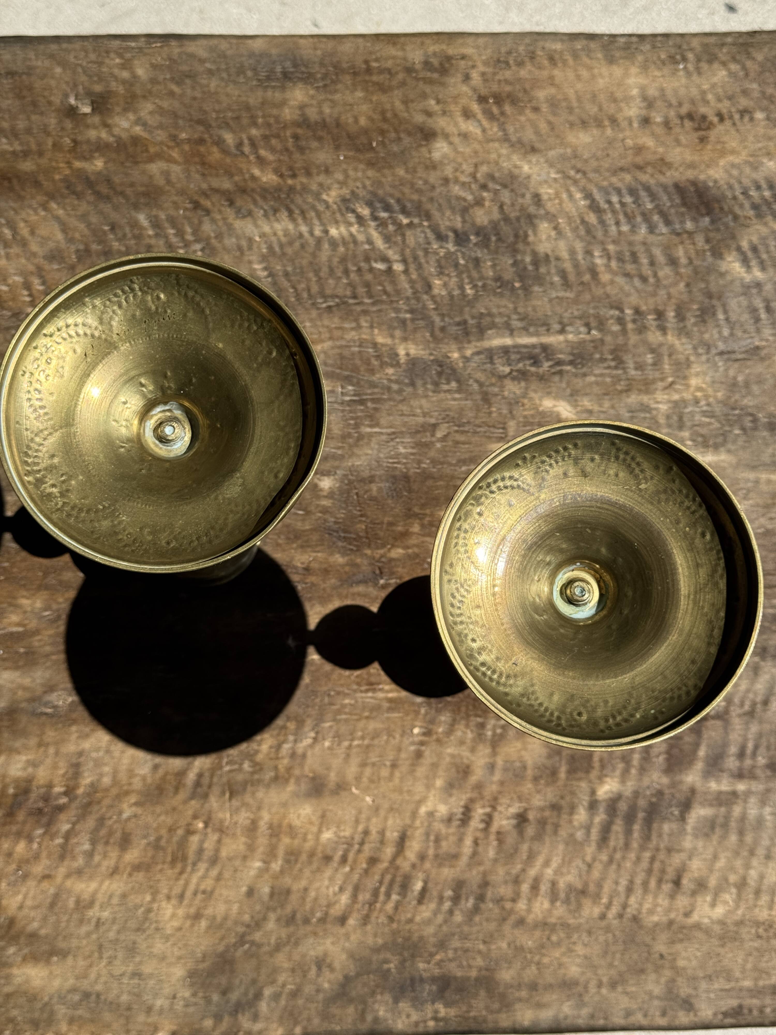 Pair of gilded candlesticks with engraved flower garland motifs H22