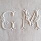 Damask tablecloth monogrammed GM, 1m55 x 2m90