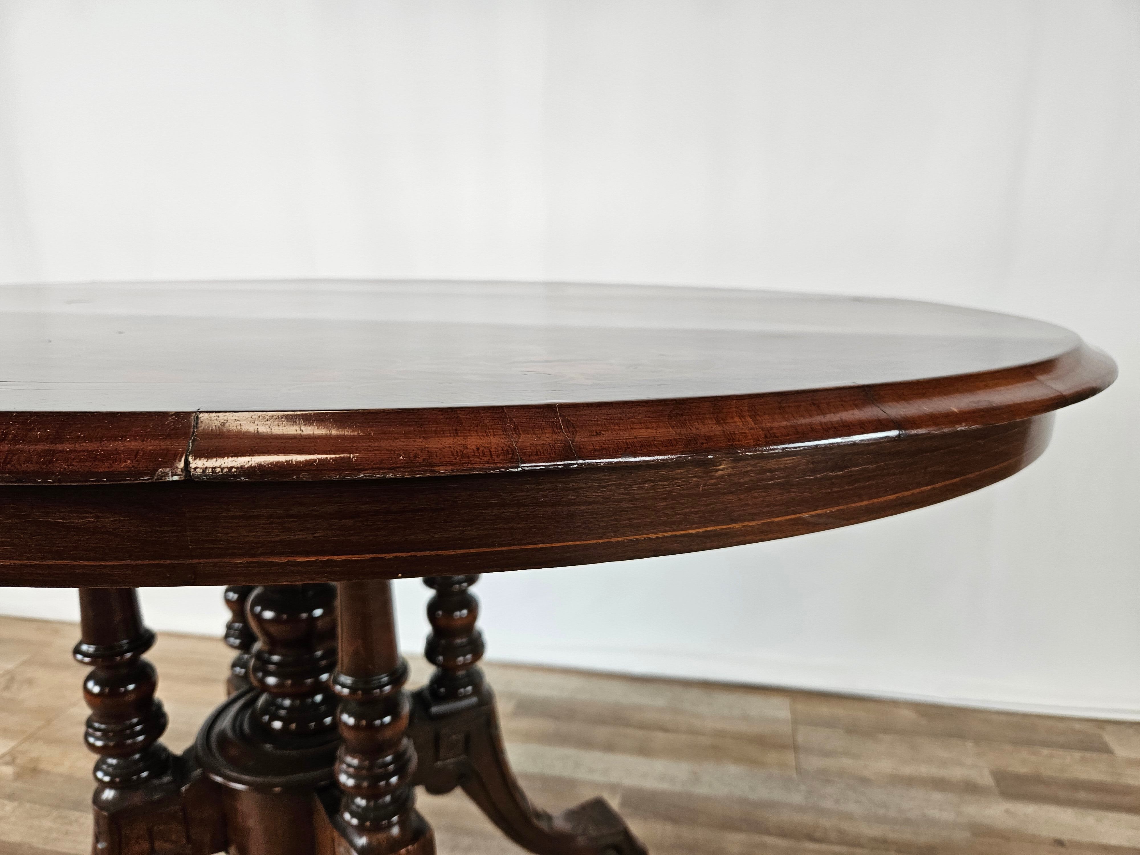 Coffee table in walnut with maple inlays and wheels