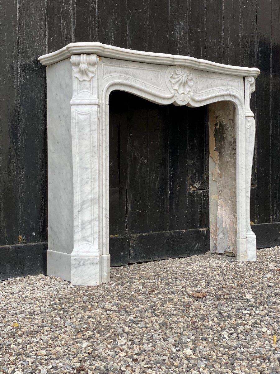 Louis XV style fireplace in Carrara marble