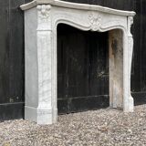 Louis XV style fireplace in Carrara marble