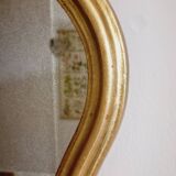 Free form mirror in golden wood