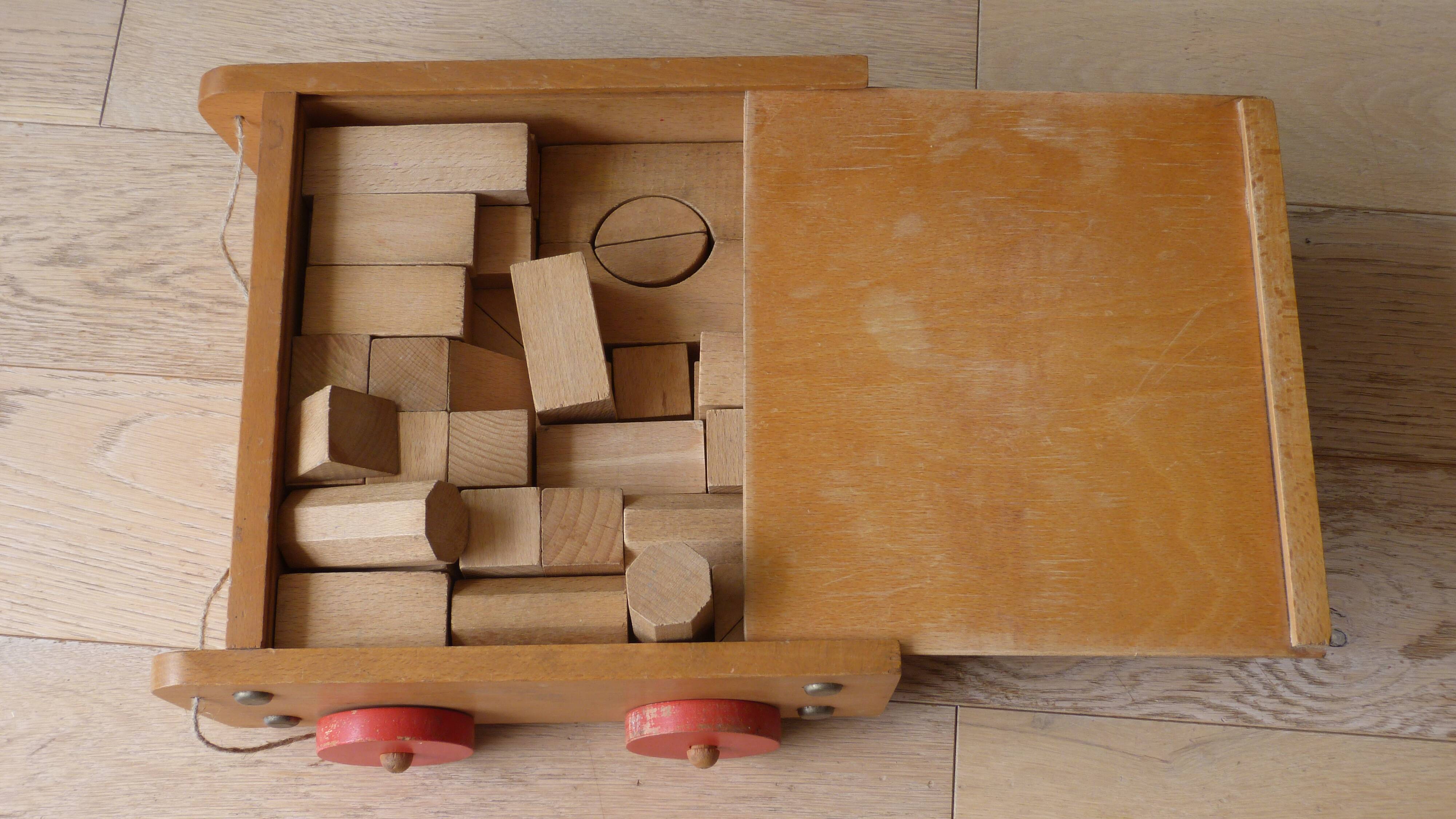 Old raw wood construction game in its cart