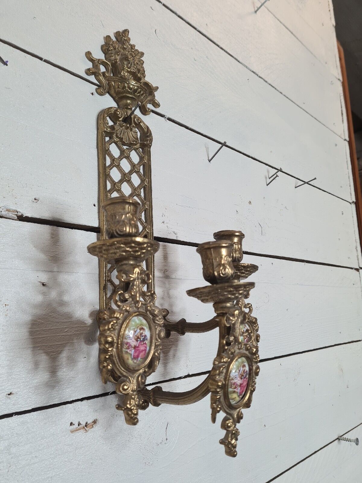 Bronze wall candle holder
