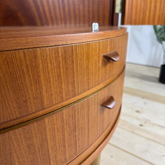 Mid-century modern corner furniture in teak with doors.