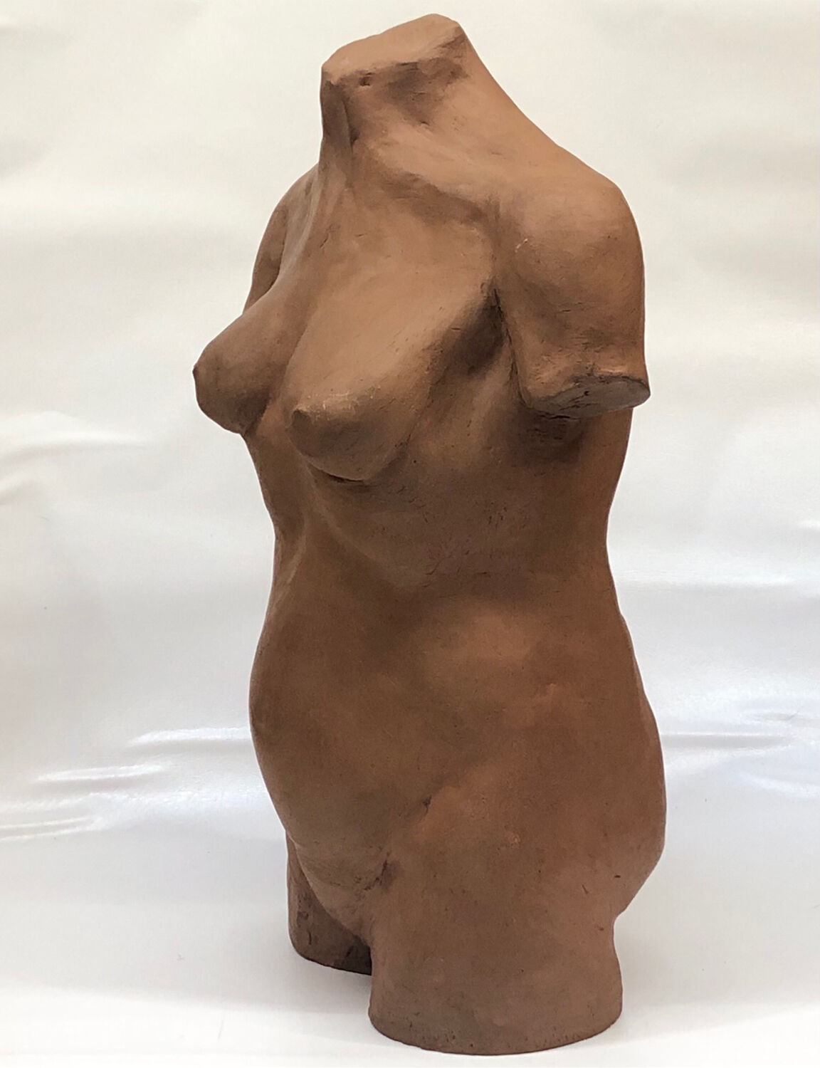 School bust of a female body in red clay terracotta