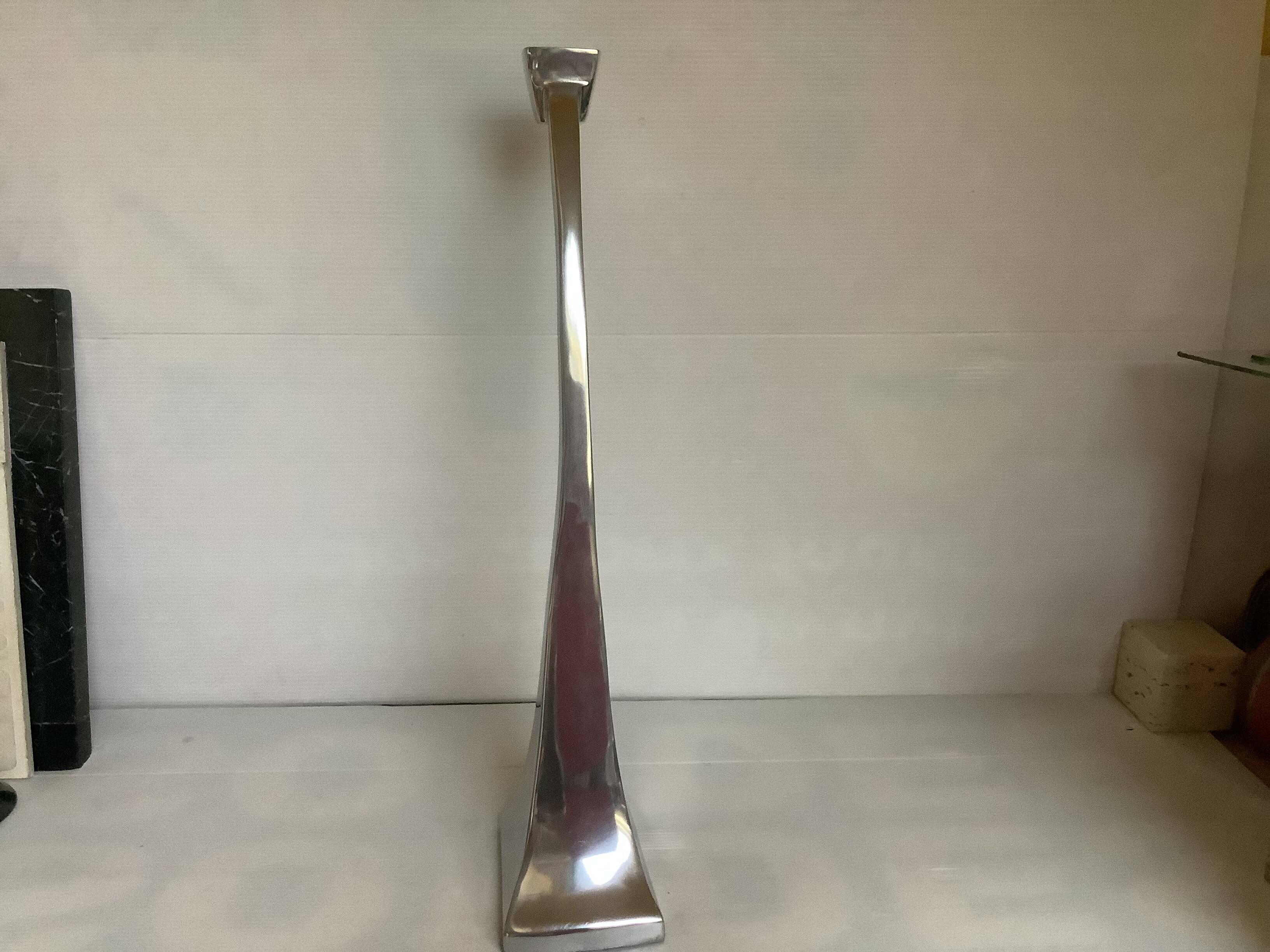 Large silver metal candlestick in the style of Xavier Lust