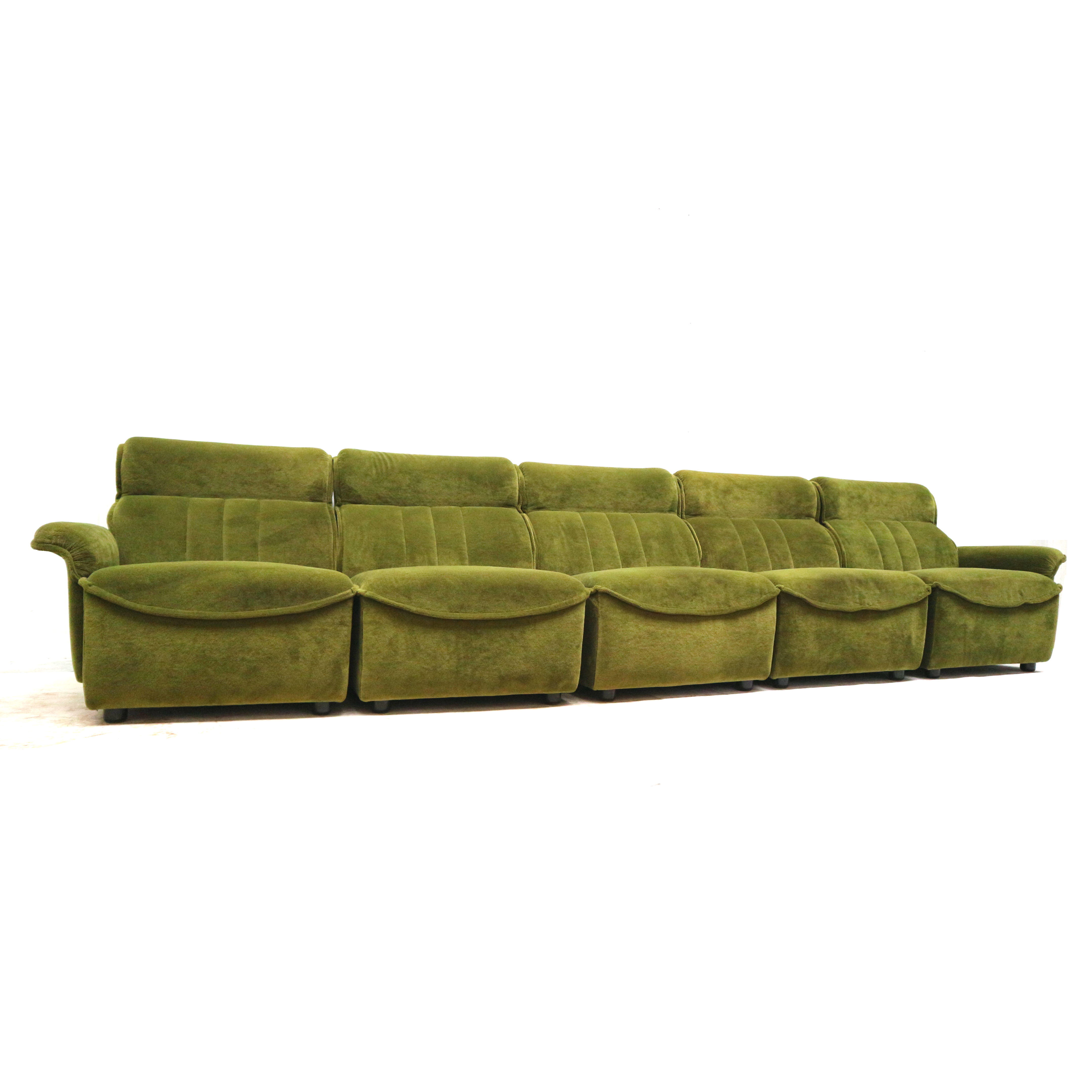 Green velvet vintage element sofa made in the 1970s