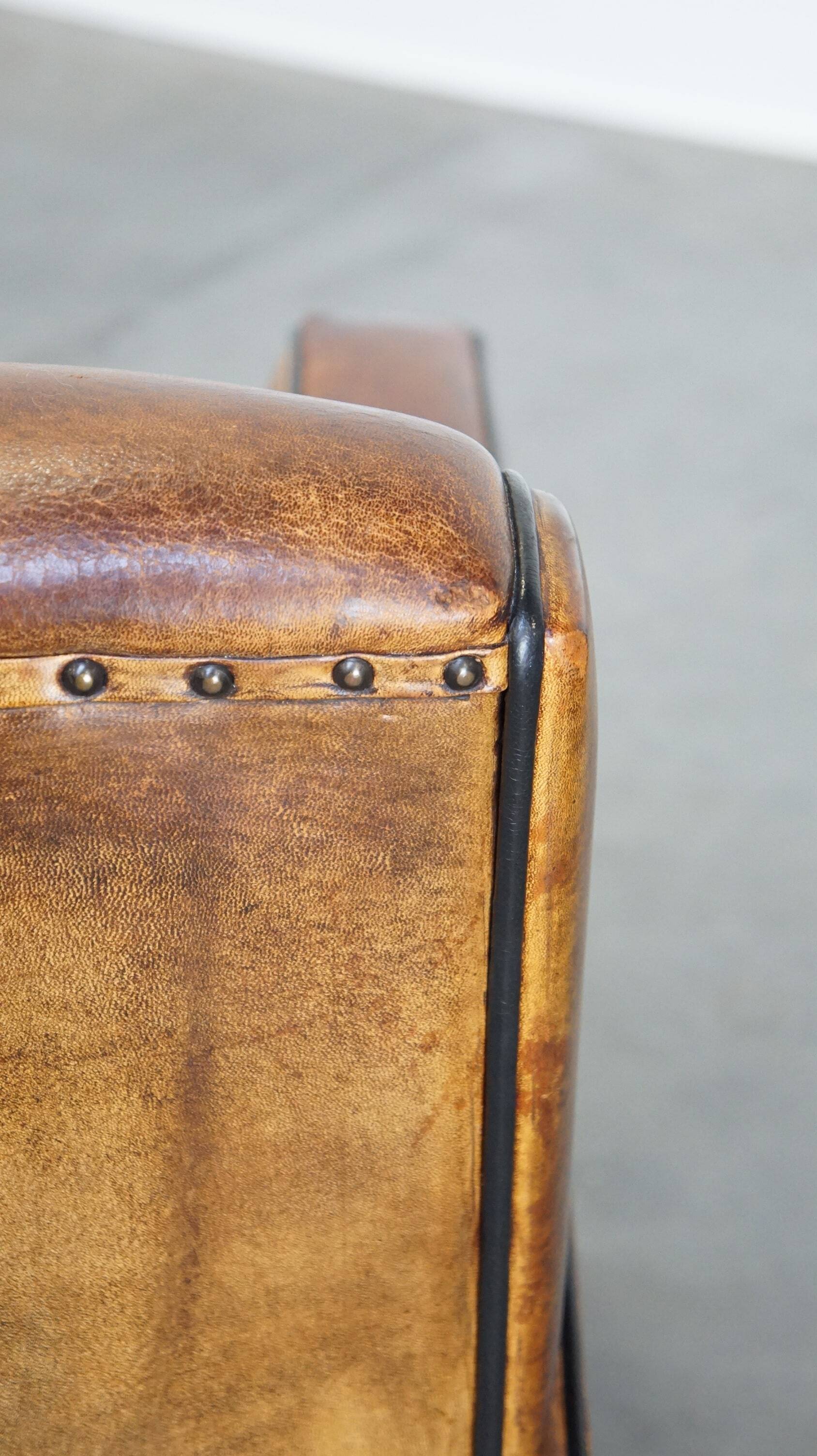 Art Deco sheep leather armchair with a lot of character