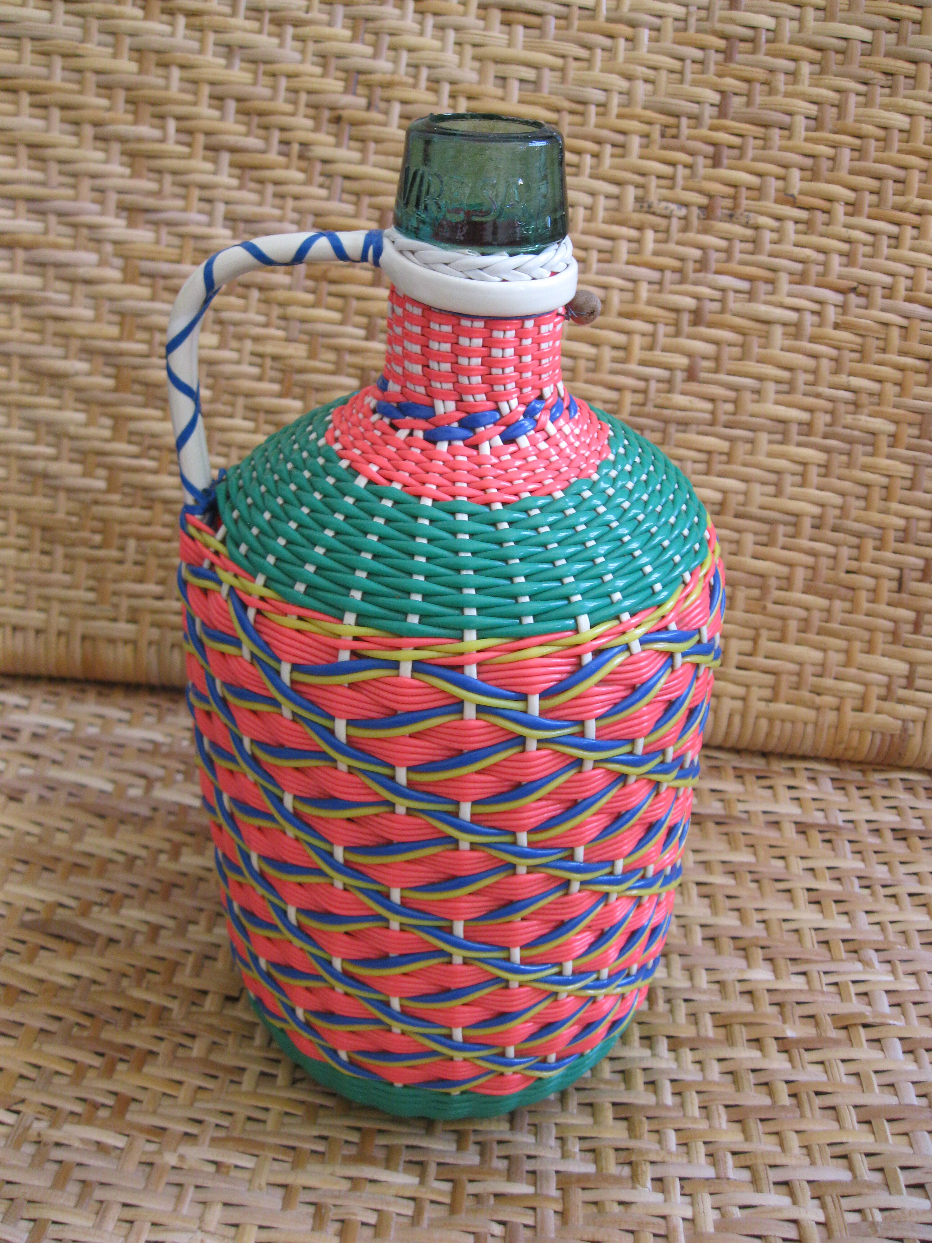Vintage and multi-coloured demijohn