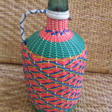 Vintage and multi-coloured demijohn
