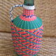 Vintage and multi-coloured demijohn
