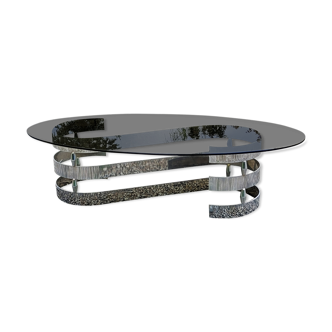 Oval coffee table of the 70s chromed metal base in s smoked glass top