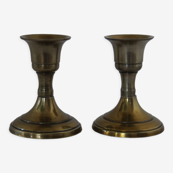 Small golden metal candle holders