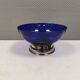 Beautiful blue glass bowl mounted on silver colored base (Original).
