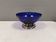 Beautiful blue glass bowl mounted on silver colored base (Original).