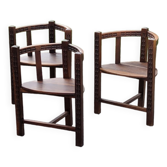 Set of three brutalist tripod armchairs in carved solid oak
