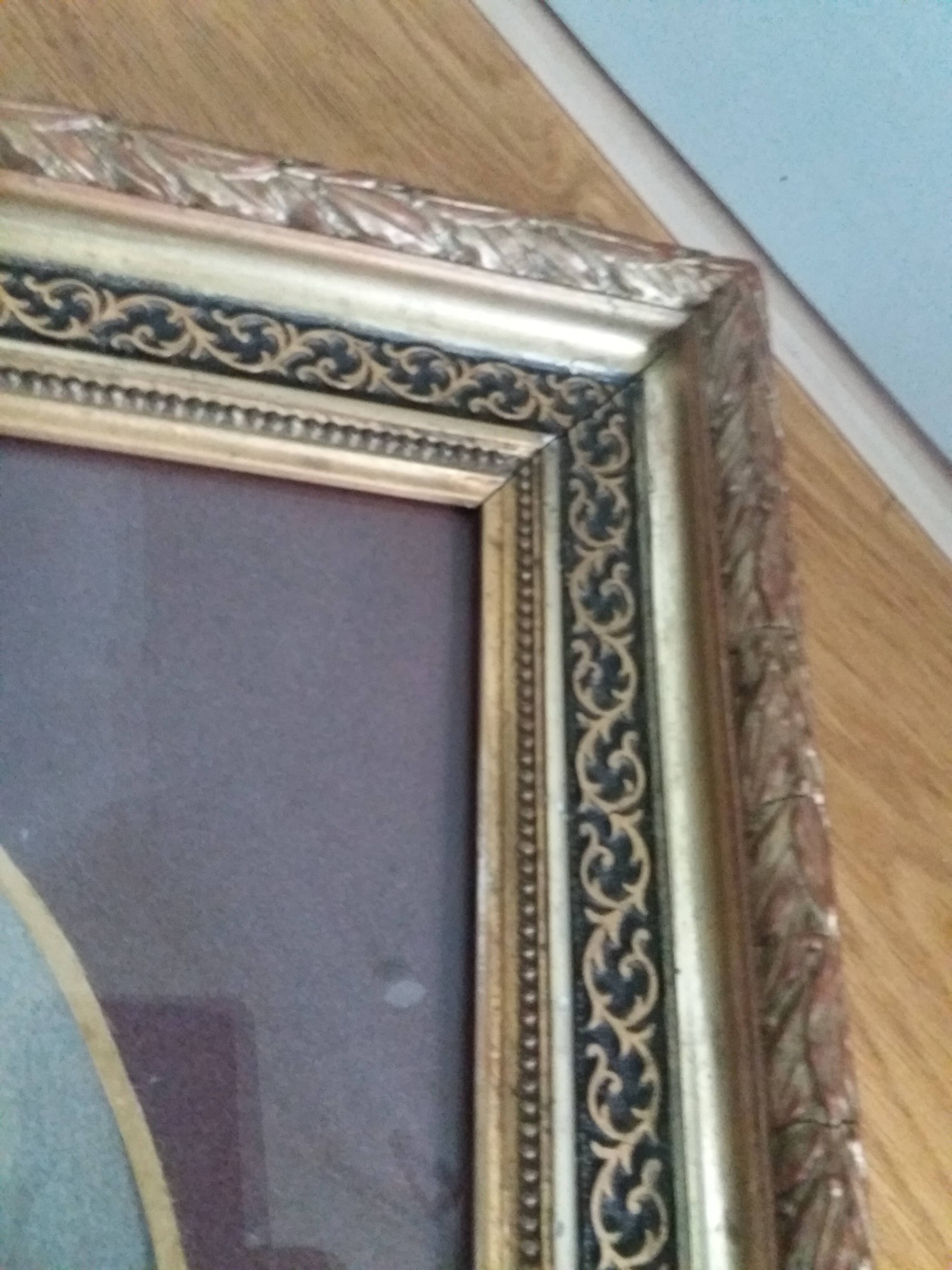 Old photo portrait framed in wood and stucco