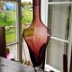 Purple-colored liquor-blown glass decanter with carved foot