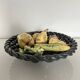 Large woven bowl and trompe l'œil fruits