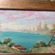 Pair of Art Deco wood and embossed metal landscape frames