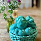 Vintage green earthenware plate/basket with fruit decorations.