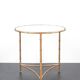 Vintage table / side table in gold metal with a mirrored top.