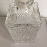 Bottle of whisky in chiseled glass