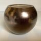 Small round vase, cracked golden ceramic.