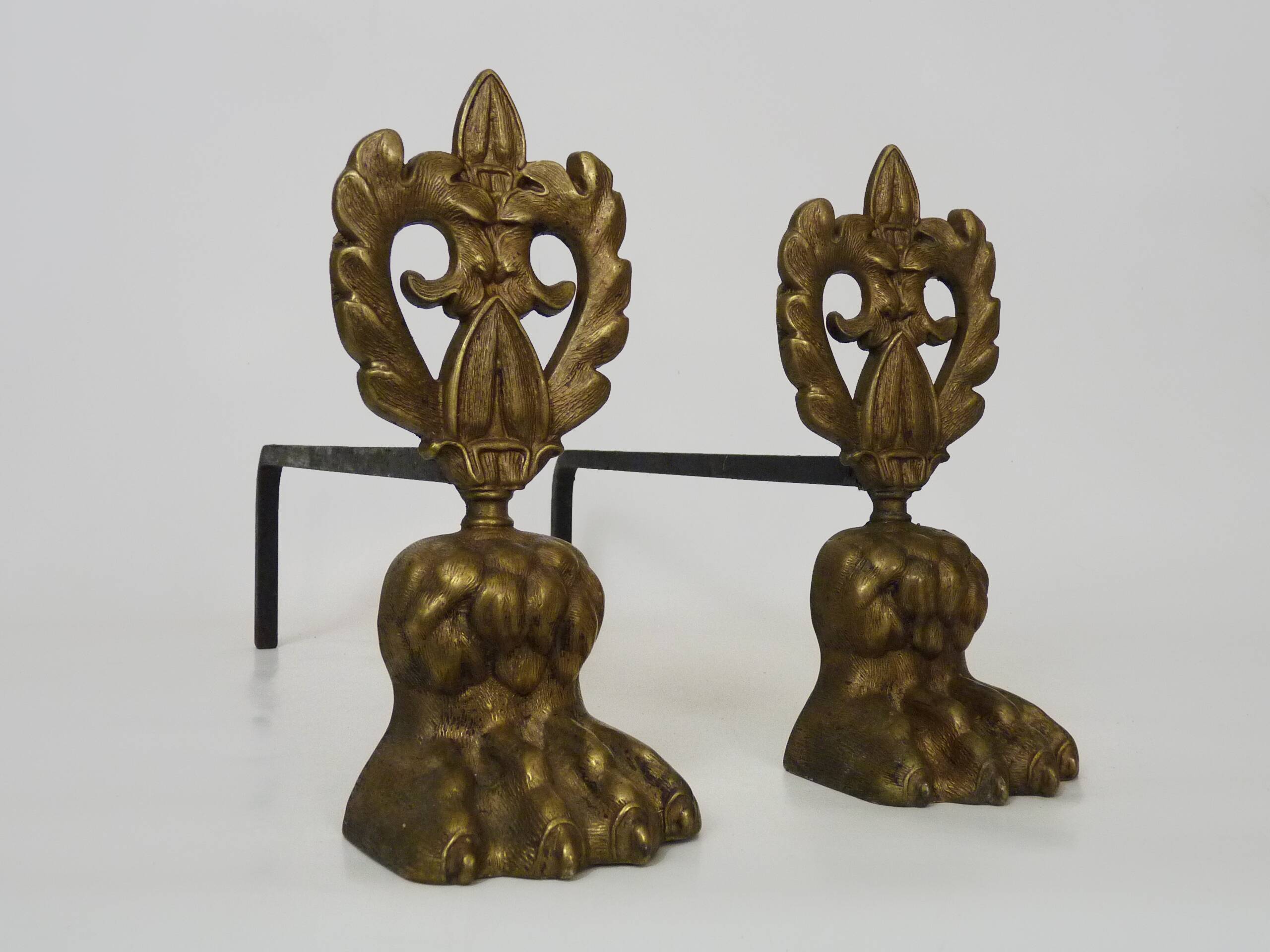 Pair of bronze fire dogs with lion paws. Early 20th century.