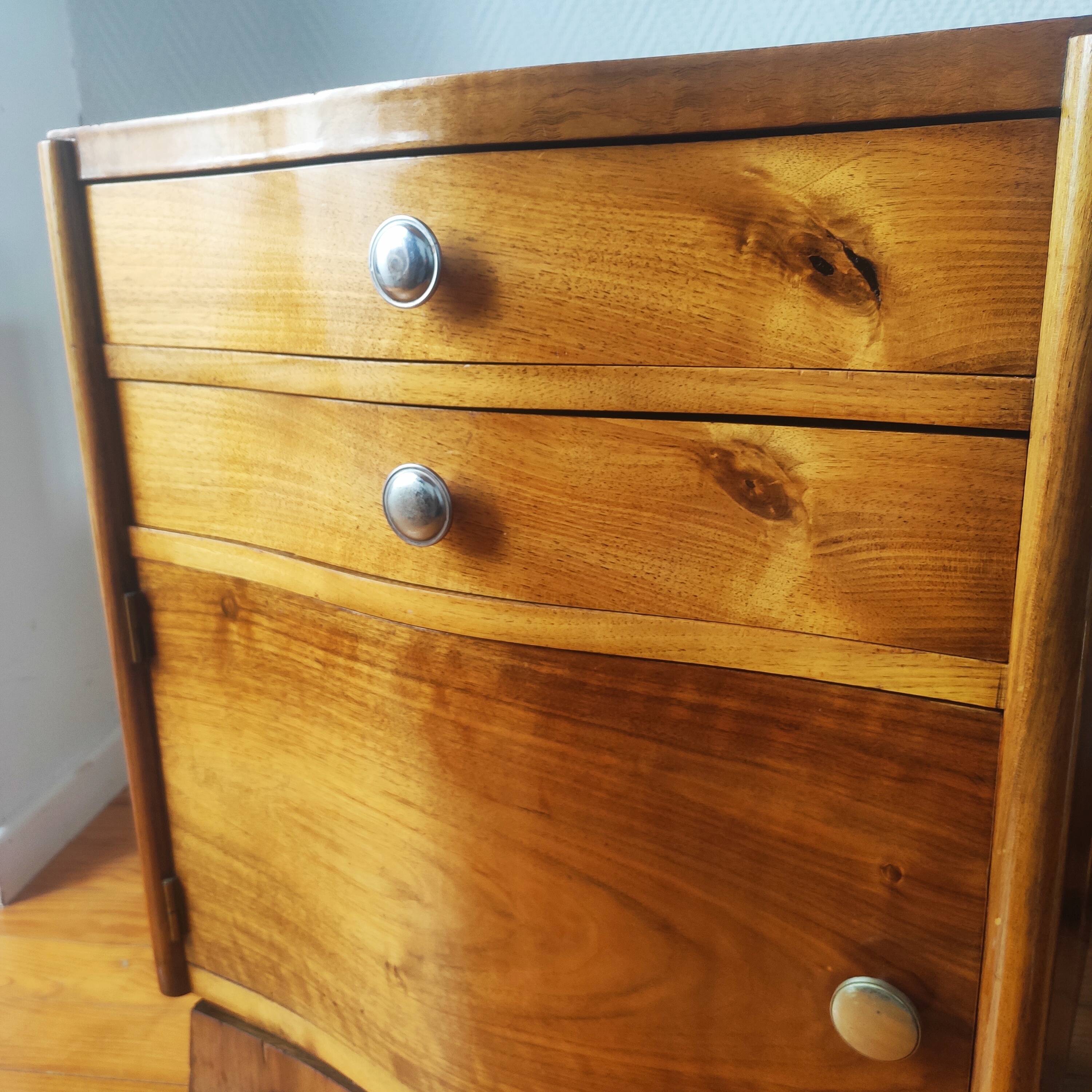 Pair of Art Deco curved bedside tables in light wood.
