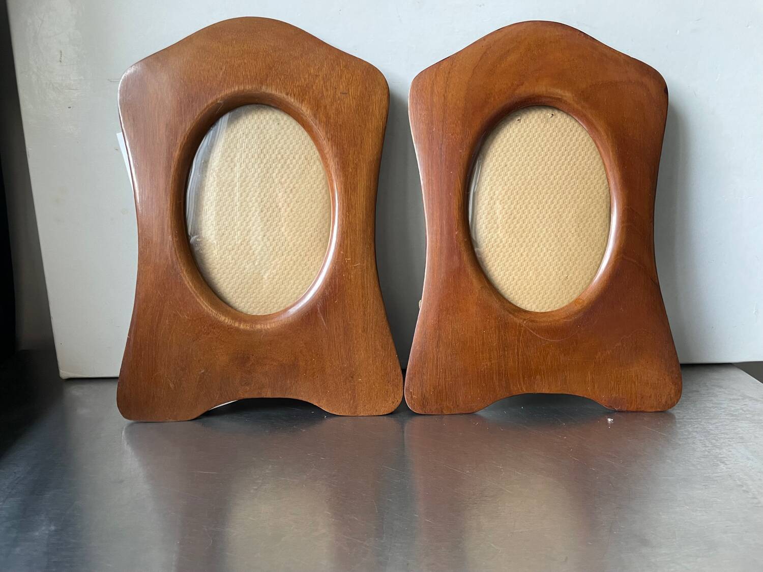 Pair of antique  identical art deco mahogany wooden frames measurements each  25 cm x 17.5 cm  convex glasses